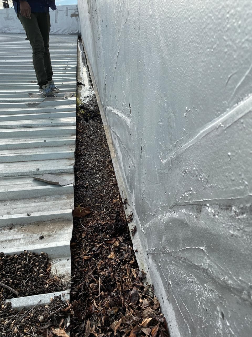 Gutters before waterproofing, showing leaks and wear