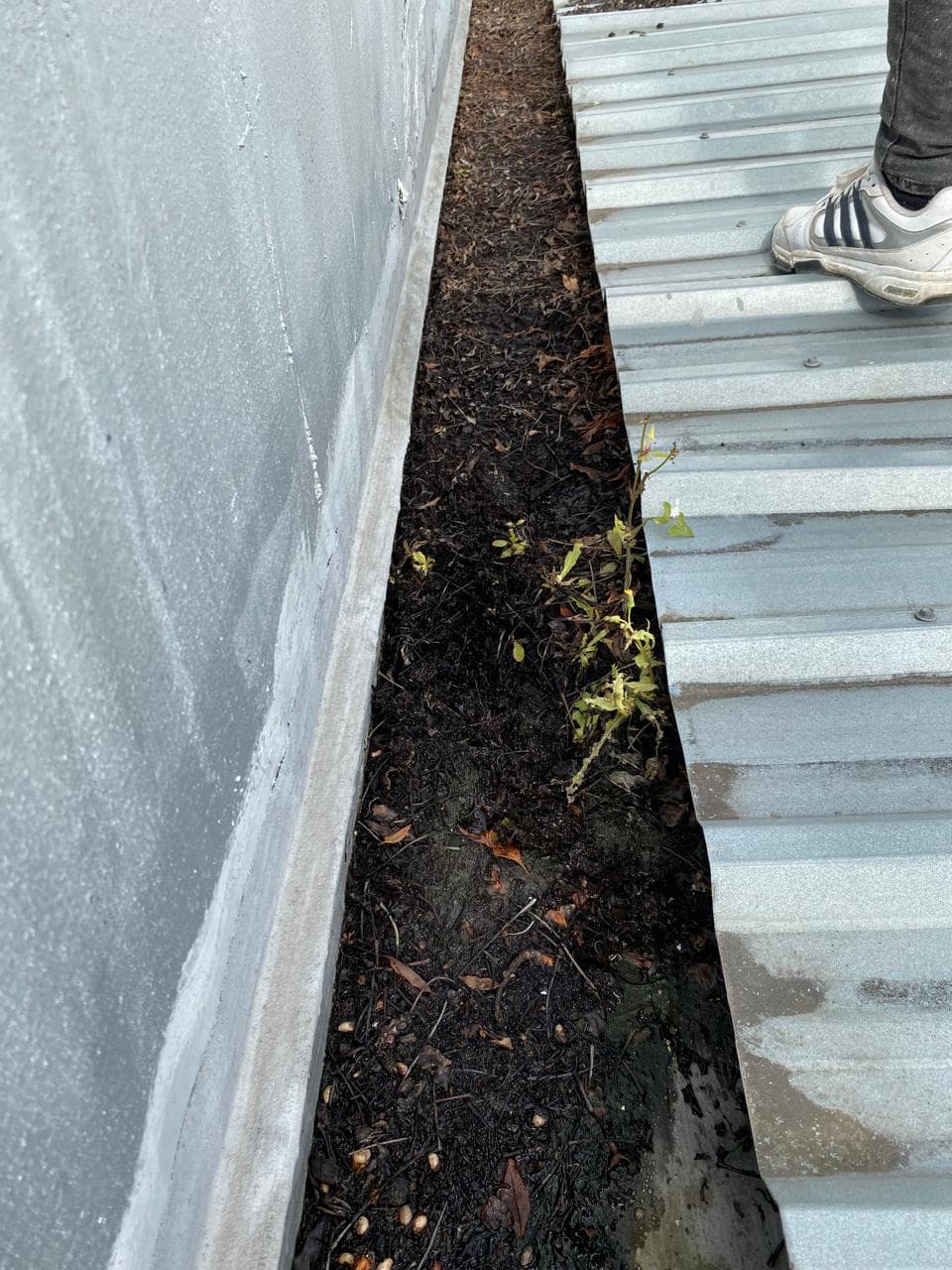 Gutters before waterproofing, close-up of damage