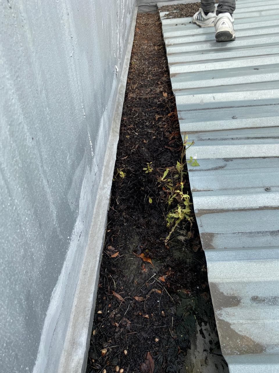 Gutters before waterproofing, wider view