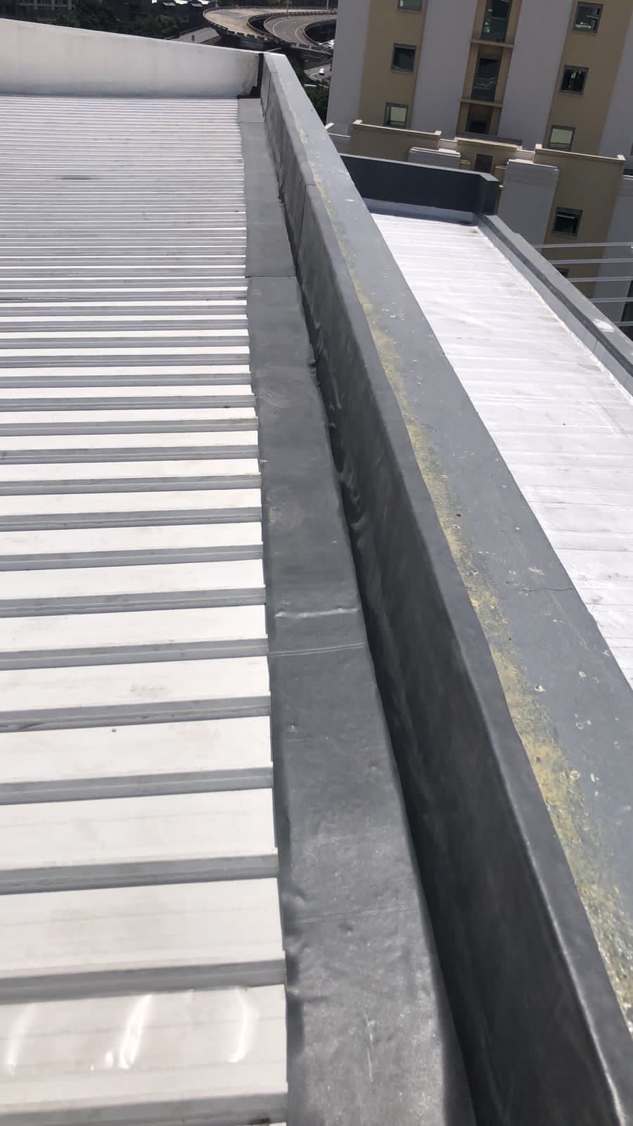Hotel roof waterproofing work in progress, alternate angle